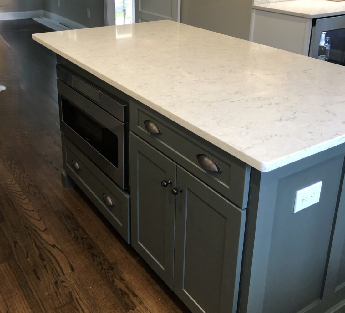 A kitchen with an oven and counter top